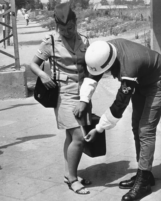 Framed Print : Military Police Measuring Woman'S Skirt Framed Print : Military Police Measuring Woman'S Skirt