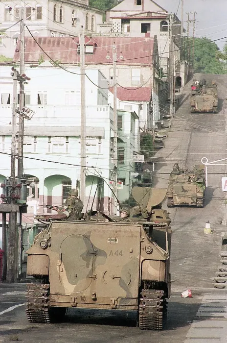 Framed Print : Military Vehicle Drives Down Street Framed Print : Military Vehicle Drives Down Street