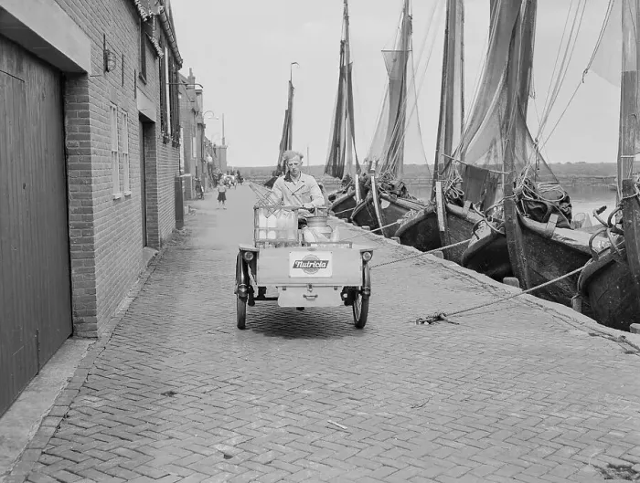 Framed Print : Milk Man on Motor Vehicle at Harbor Framed Print : Milk Man on Motor Vehicle at Harbor