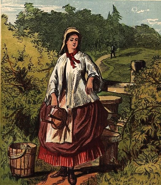 Milkmaid. circa 1880: A milkmaid with a wooden bucket