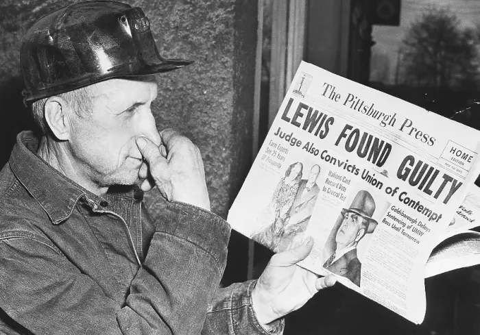 Framed Print : A Miner Reacts to a Newspaper Headline