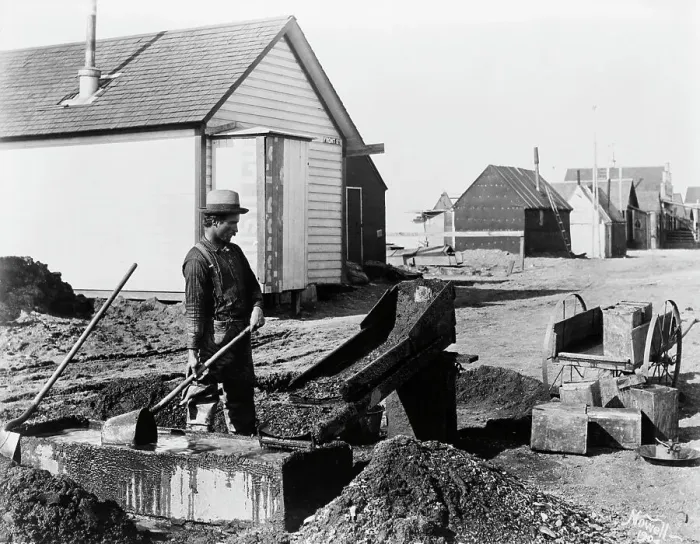 Framed Print : Miner Shoveling Rocks At Gold Mine Framed Print : Miner Shoveling Rocks At Gold Mine