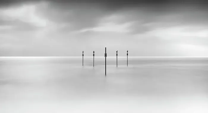 Framed Print : Minimal posts are arranged symmetrically in sea Framed Print : Minimal posts are arranged symmetrically in sea