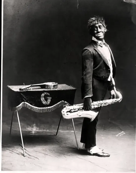 Framed Print : Minstrel Performer Holding Saxophone Framed Print : Minstrel Performer Holding Saxophone