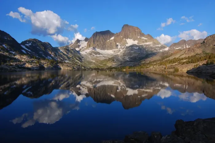 Framed Print : Mirror-like reflections of mighty peaks in an alpine lake Framed Print : Mirror-like reflections of mighty peaks in an alpine lake
