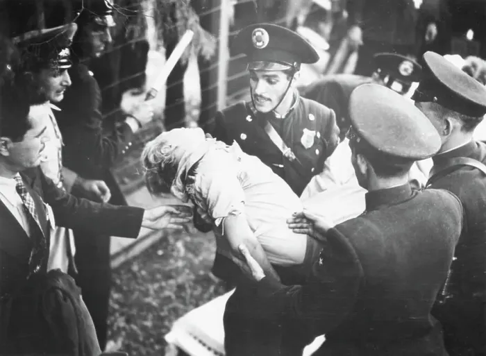 Framed Print : Miss Helie Nice Being Carried By Officer Framed Print : Miss Helie Nice Being Carried By Officer