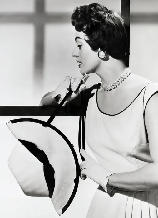 Framed Print : Model Manipulates Panama Hat Into A Bag Framed Print : Model Manipulates Panama Hat Into A Bag