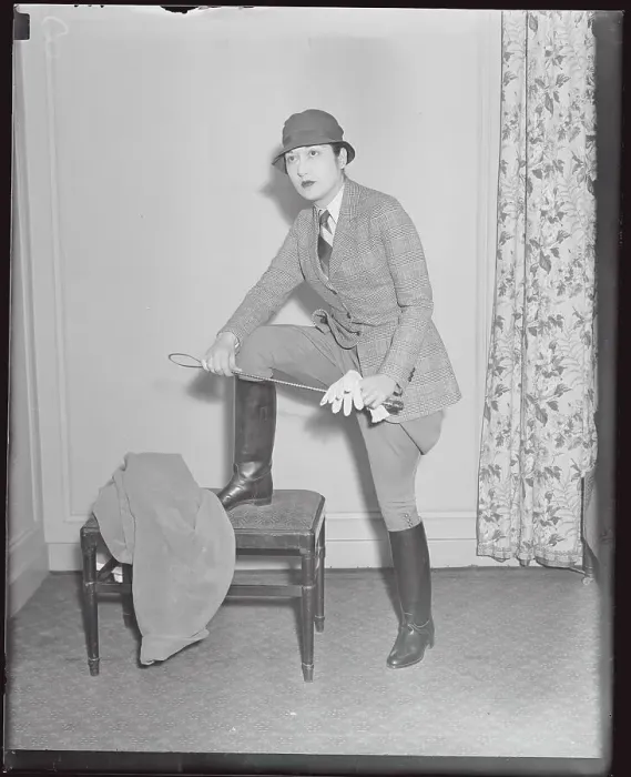 Framed Print : Model Posing with Propped Leg in Riding Suit