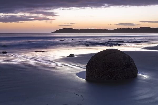 Moeraki Boulders on the beach at sunrise, Moeraki Beach, Hampden, Otago Region, New Zealand