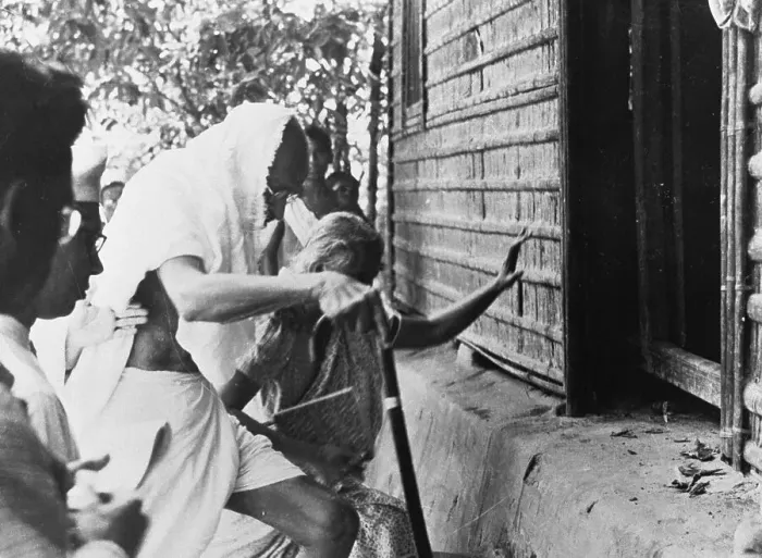 Framed Print : Monandas Gandhi Entering a House Framed Print : Monandas Gandhi Entering a House
