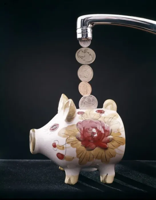Framed Print : Money Pouring Into Piggy Bank Framed Print : Money Pouring Into Piggy Bank