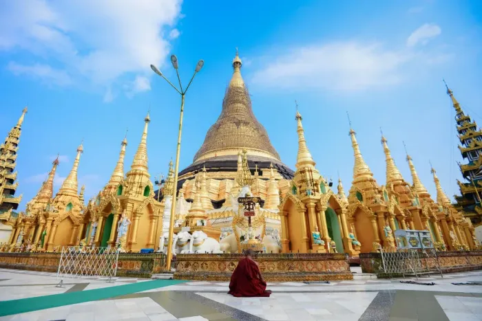 Framed Print : A monk meditate in front of the Shwedagon Pagoda