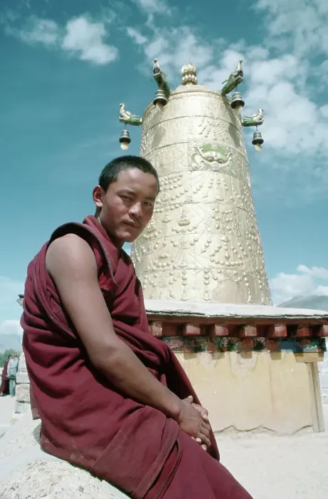 Framed Print : Monk Sits Before Brass Bell Tower Framed Print : Monk Sits Before Brass Bell Tower