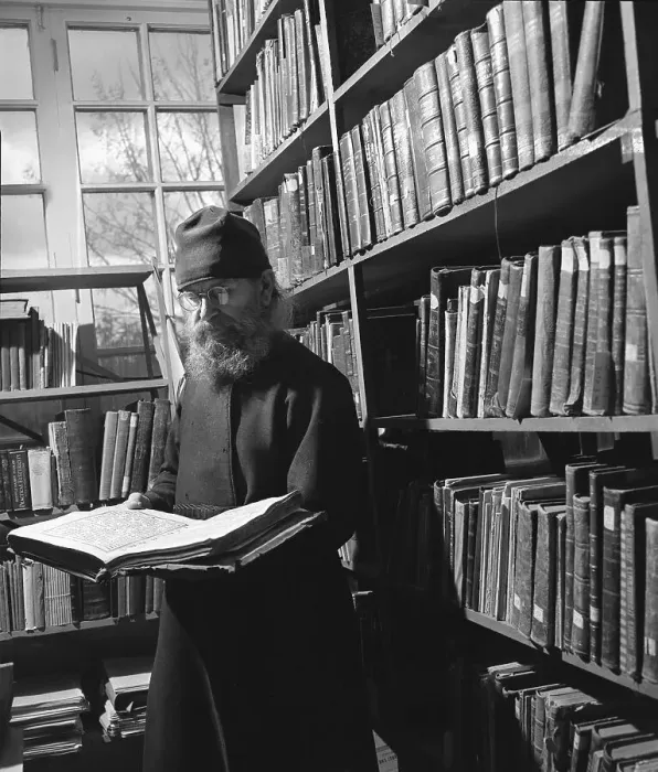 Framed Print : Monk Studying Book In Library Framed Print : Monk Studying Book In Library