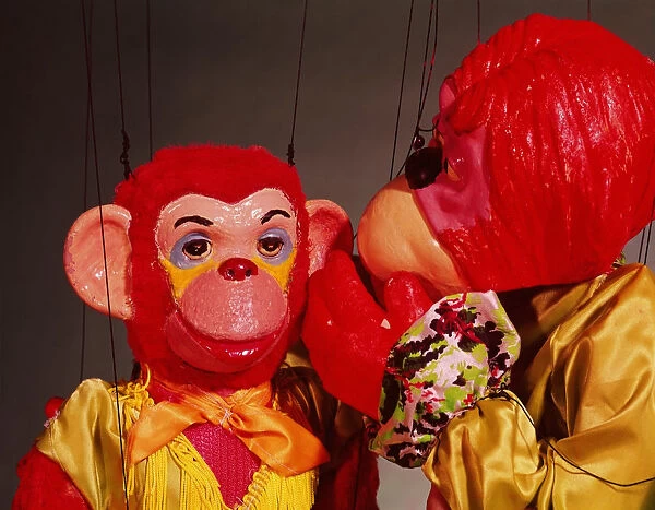 Monkey puppets whispering