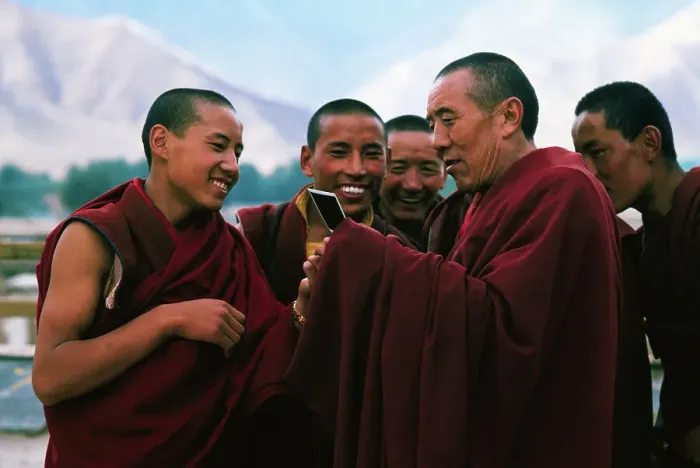 Framed Print : Monks Examining Polaroid Photo Framed Print : Monks Examining Polaroid Photo