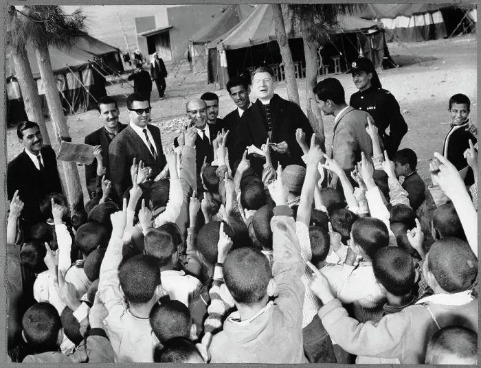 Framed Print : Monsignor John Roudan Surrounded by Young People Framed Print : Monsignor John Roudan Surrounded by Young People