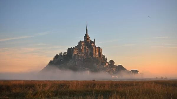Mont-Saint-Michel Abbey at sunset, Normandy, France