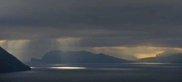 Mood light with low-hanging clouds, Koltur and Vagar islands, Faroe Islands, Denmark