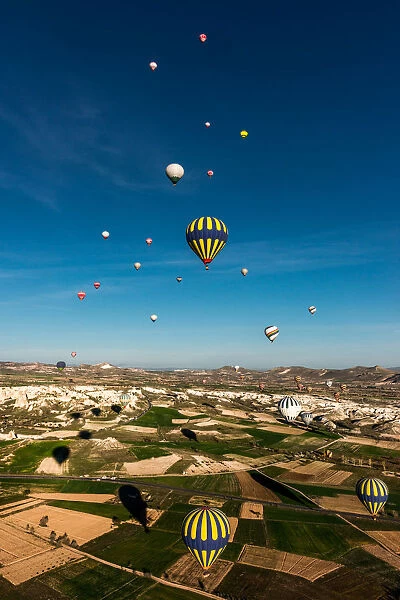 Morning balloons over Cappadocia landscape
