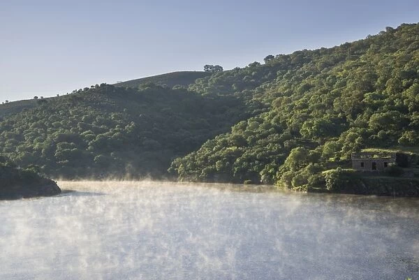 Morning fog at the Alcantara Dam or Embalse de Jose Maria de Oriol-II Alcantara, Extremadura, Spain