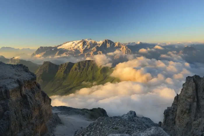 Framed Print : Morning mist in the valley below Marmolada peak, Dolomites