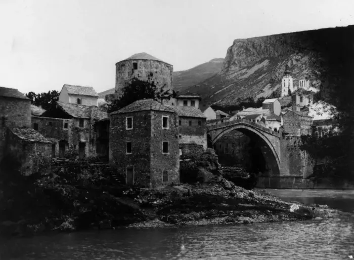 Framed Print : Mostar. circa 1910: The stone arch bridge over the River Neretva in the Framed Print : Mostar. circa 1910: The stone arch bridge over the River Neretva in the