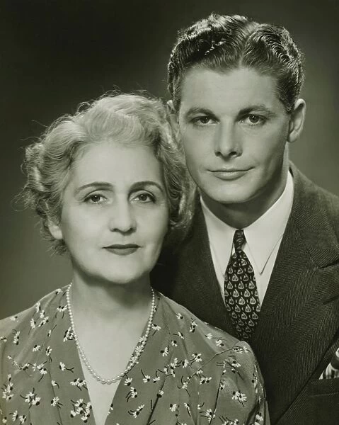 Mother and adult son, formal portrait, in studio, (B&W), portrait