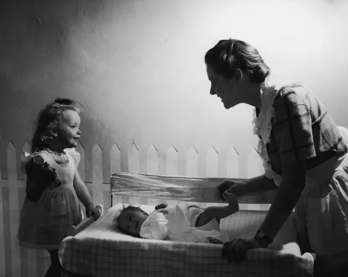 Framed Print : Mother with baby and daughter (6 months to 6 years) smiling (B&W)