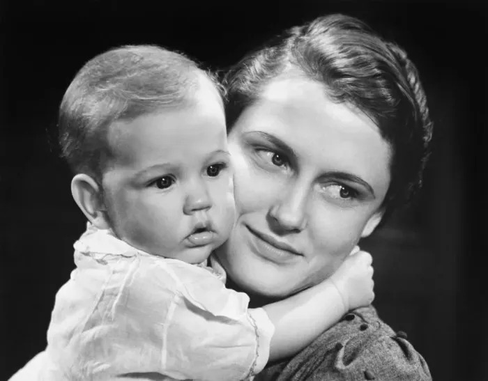 Framed Print : Mother with baby girl (9-12 months) posing in studio, (B&W), portrait