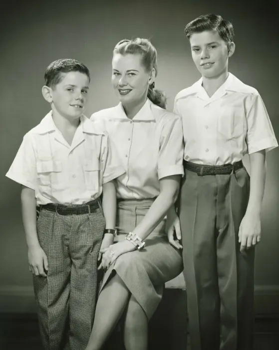 Framed Print : Mother with brothers (8-9) (10-11) sitting in studio, smiling, (B&W), portrait Framed Print : Mother with brothers (8-9) (10-11) sitting in studio, smiling, (B&W), portrait