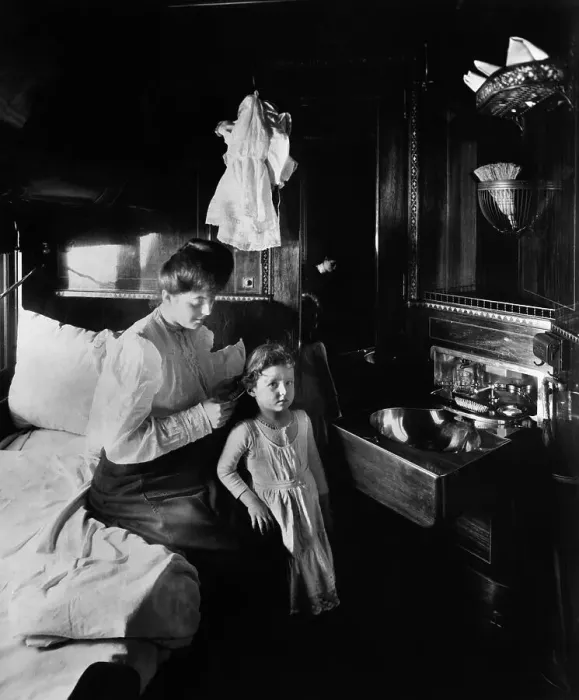 Framed Print : Mother Brushing Daughter's Hair on Train Framed Print : Mother Brushing Daughter's Hair on Train