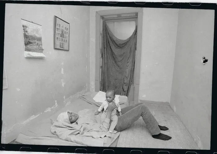 Framed Print : Mother and Child Playing in Poorly Furnished Bedroom Framed Print : Mother and Child Playing in Poorly Furnished Bedroom
