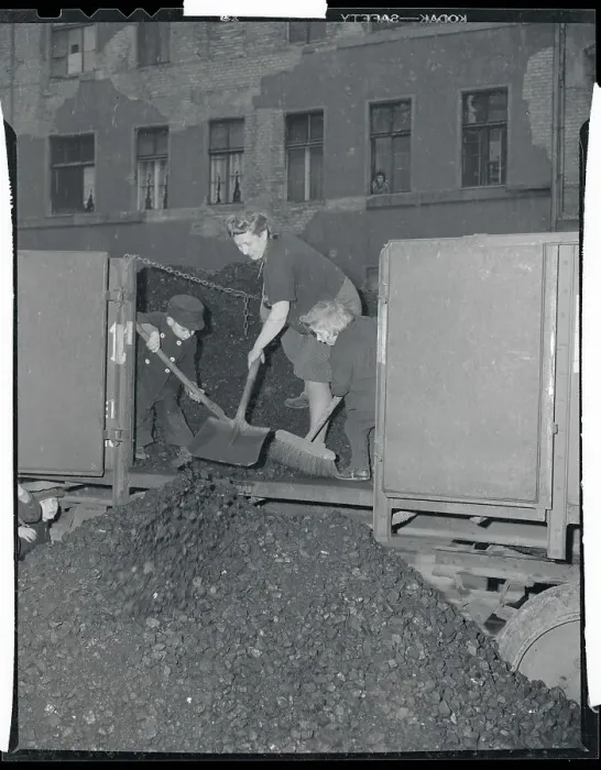 Framed Print : Mother and Children Shoveling Coal