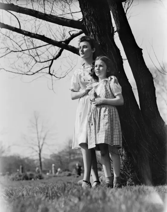 Framed Print : Mother and daughter (8-9) standing under tree Framed Print : Mother and daughter (8-9) standing under tree