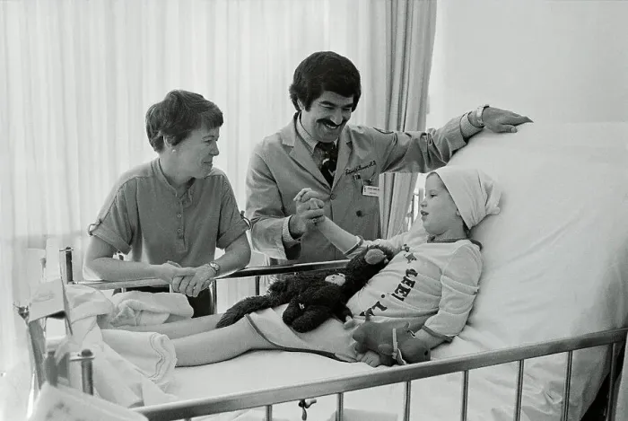 Framed Print : Mother and Doctor at Girl's Side in Hospital Framed Print : Mother and Doctor at Girl's Side in Hospital