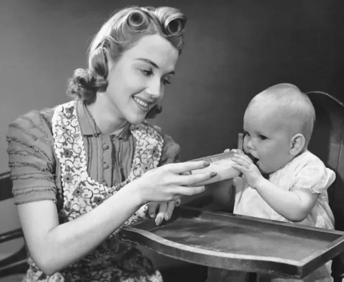 Framed Print : Mother holding bottle for baby Framed Print : Mother holding bottle for baby