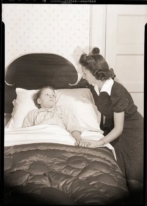 Framed Print : Mother Holding Child's Hand in Bed Framed Print : Mother Holding Child's Hand in Bed