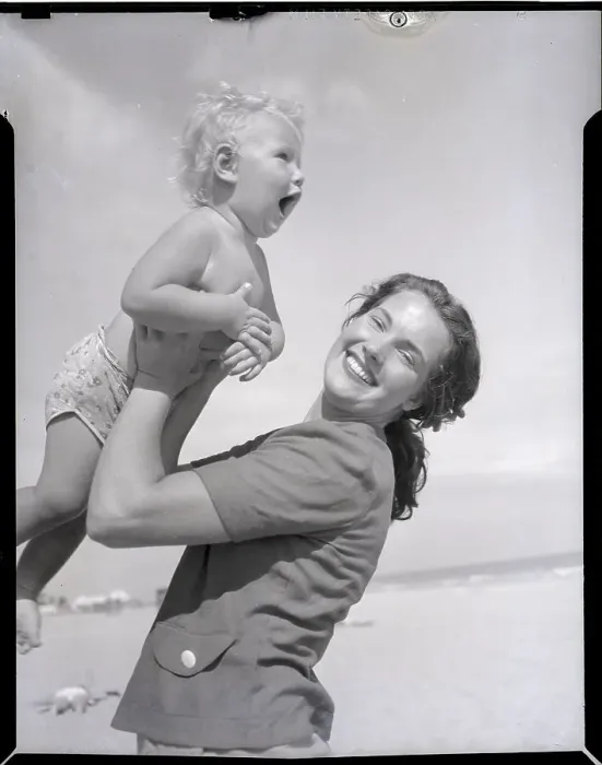 Framed Print : Mother Lifting Smiling Toddler at the Beach