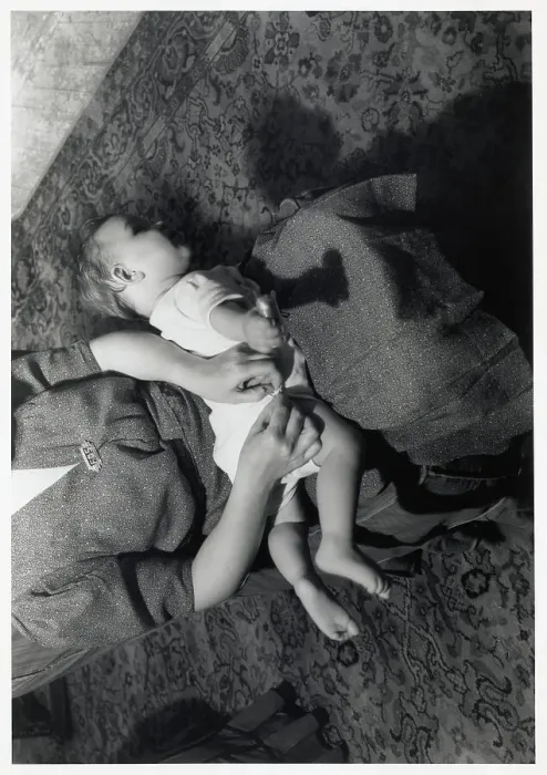 Framed Print : Mother Pinning Diaper On Baby in Lap Framed Print : Mother Pinning Diaper On Baby in Lap