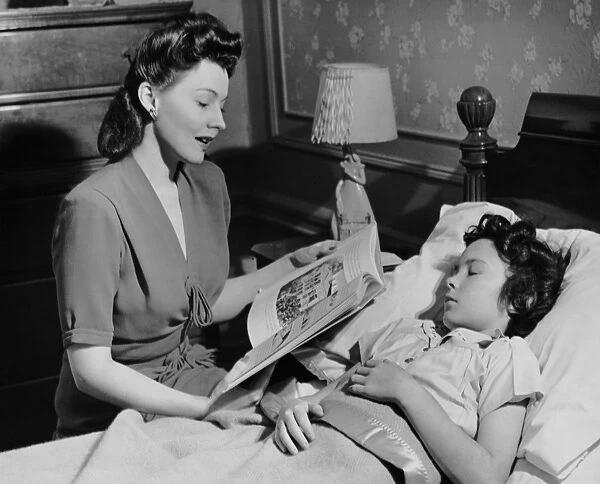 Mother reads child a bedtime story