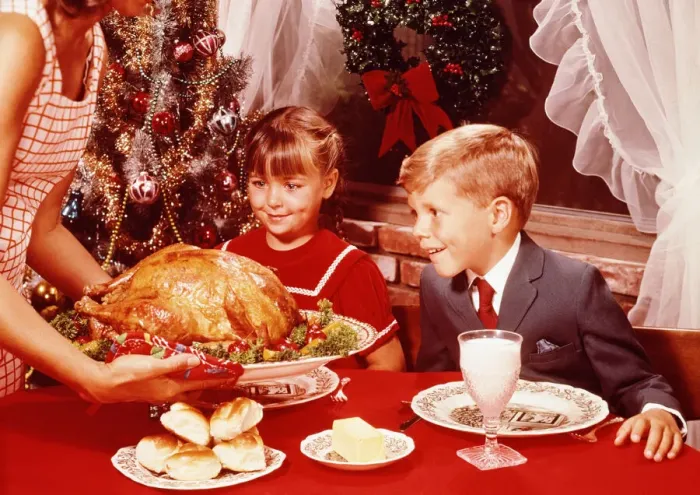 Framed Print : Mother showing roast turkey to children (7-10) at Christmas meal Framed Print : Mother showing roast turkey to children (7-10) at Christmas meal