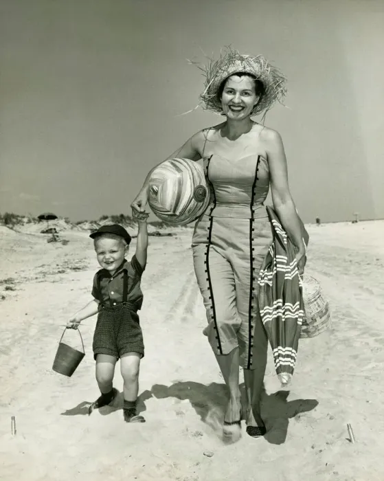 Framed Print : Mother with son (2-3) walking on beach, (B&W), portrait Framed Print : Mother with son (2-3) walking on beach, (B&W), portrait