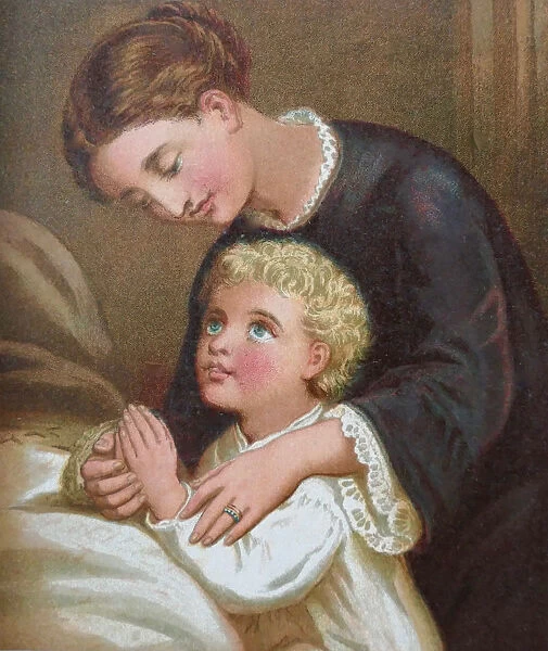 Mother and son praying at bed