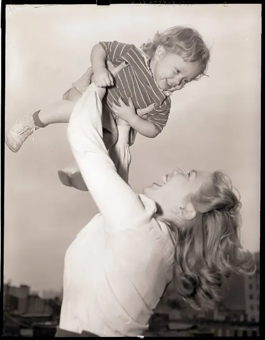 Framed Print : Mother Swinging Daughter Up in the Air