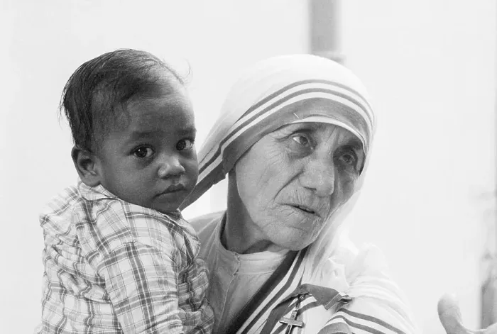 Framed Print : Mother Teresa Holding Young Boy