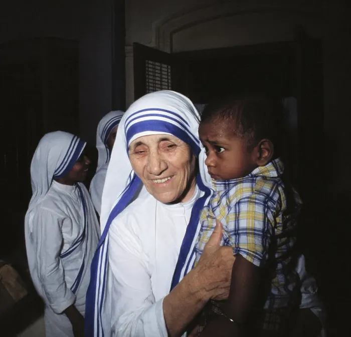 Framed Print : Mother Teresa Holding Young Boy Framed Print : Mother Teresa Holding Young Boy