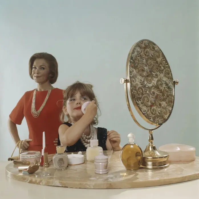 Framed Print : Mother watching daughter applying make-up Framed Print : Mother watching daughter applying make-up