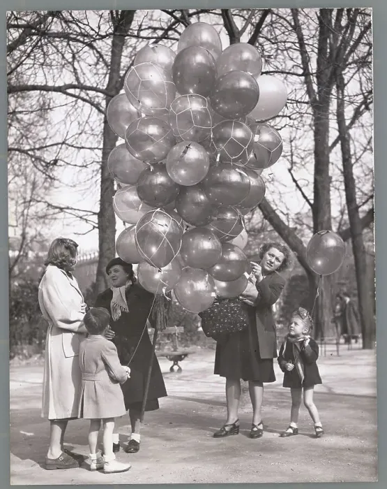 Framed Print : Mothers with Their Children Buying Balloons in the Park Framed Print : Mothers with Their Children Buying Balloons in the Park
