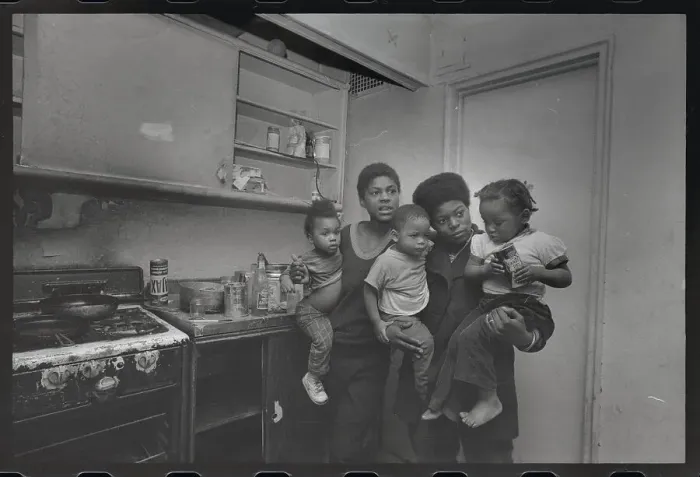 Framed Print : Mothers Holding Children by Stove for Warmth Framed Print : Mothers Holding Children by Stove for Warmth